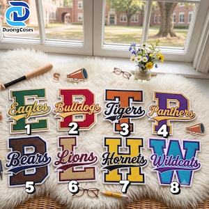 May include: Eight varsity-style letter patches featuring team names: Eagles, Bulldogs, Tigers, Panthers, Bears, Lions, Hornets, and Wildcats. Each letter is rendered in a unique color combination with a script font overlay and a numbered label.