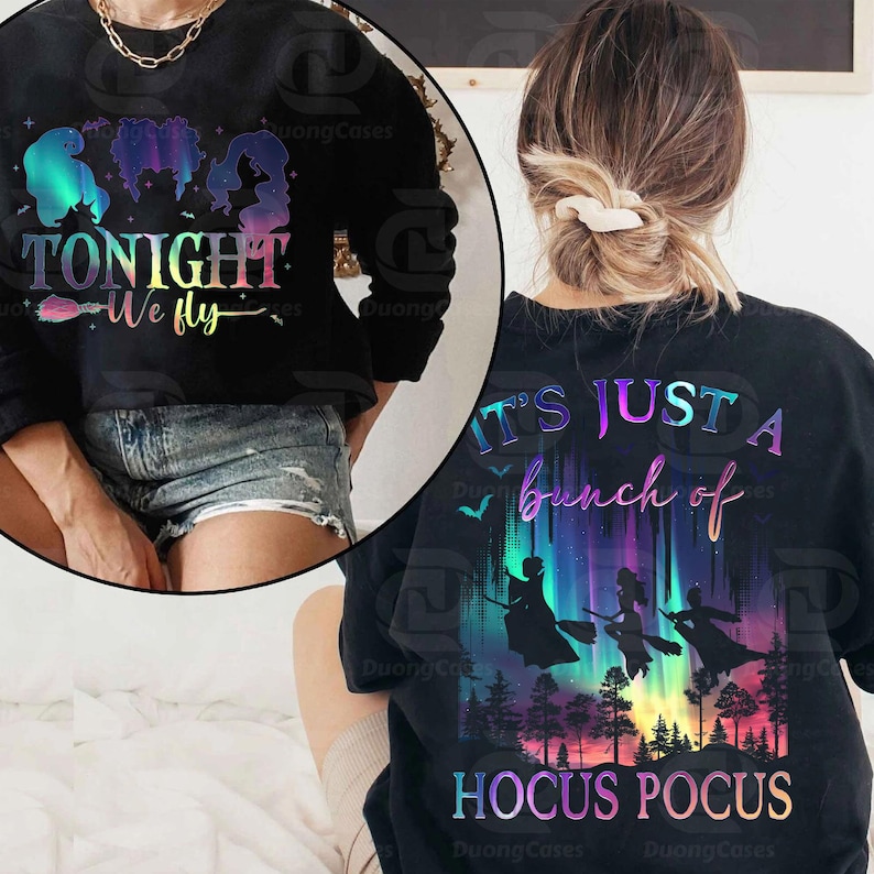 May include: Black sweatshirt with the text "TONIGHT We fly" and silhouettes of three figures. The back of the sweatshirt features the text "IT'S JUST A bunch of HOCUS POCUS" with silhouettes of witches flying over a forest.