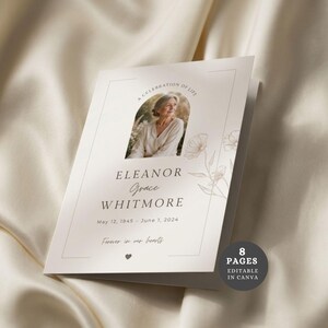 May include: A folded funeral program booklet with a cream-colored cover featuring a central arched photo of a person, the text A CELEBRATION OF LIFE, ELEANOR GRACE WHITMORE, May 12, 1845 - June 1, 2024, Forever in our hearts, and a floral line drawing.