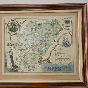 May include: A framed vintage-style map of the Charente region in France, featuring illustrations of historical figures, a coat of arms, and a legend. The map is rendered in muted green and beige tones, enclosed in a dark wood frame with a cream mat.