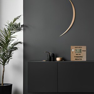 May include: A gold-colored countdown clock with a digital display showing "4118" days. The clock has the text "NUR NOCH" above the display, "TAGE" to the right of the display, "BIS ZU" below the display, and "THOMAS' RENTE" below that.