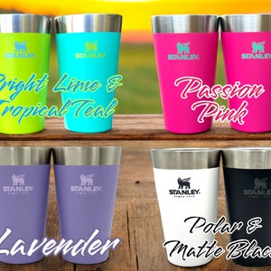 May include: Six stainless steel Stanley tumblers in various colors, including bright lime, tropical teal, passion pink, lavender, polar white, and matte black. Each tumbler features the Stanley logo and the text "STANLEY. SINCE 1913".