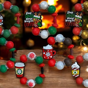 May include: Christmas-themed bracelets with red, green, white, and gold beads. Each bracelet features festive charms, including a ghost, coffee cup, and snowflake designs. Some bracelets have the text "Dear Santa please bring me COFFEE."