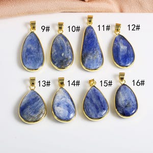 May include: Eight gold pendants with blue gemstone drops. The pendants are numbered 9 through 16.