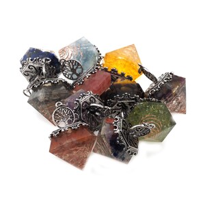 May include: A group of seven chakra crystal orgonite pyramids with silver metal accents and a tree of life design. Each pyramid is a different color, representing the seven chakras.