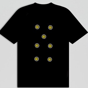 May include: Black t-shirt featuring a pattern of seven yellow sun-like designs with white borders. The suns are evenly spaced across the front of the shirt. The shirt has short sleeves and a crew neck.