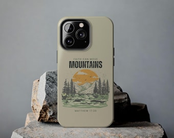 May include: A beige phone case with a mountain scene and the text "Faith can move mountains" and "Matthew 17:20".