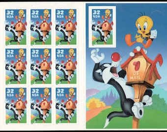 May include: Sheet of 32-cent USA stamps featuring Sylvester the Cat and Tweety Bird. The stamps depict Sylvester reaching for a birdhouse with Tweety, and a larger illustration of the characters with a mailbox. The stamps are in a sheet.