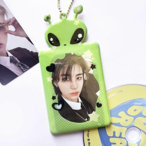 Portafotos de PVC con forma de extraterrestre