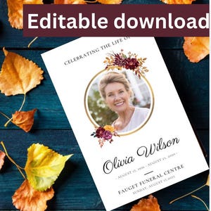 May include: A white memorial card with a gold frame and floral design. The card features a photo of a woman and the text "Celebrating the Life of Olivia Wilson, August 17, 1956 - August 23, 2020. Fauget Funeral Centre, Sunday, August 17, 2023."