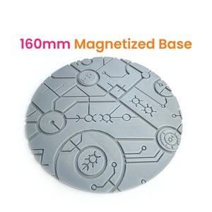 May include: A 160mm diameter round, gray, magnetized base with a detailed, futuristic design. The base features a circuit board pattern with various shapes and symbols.