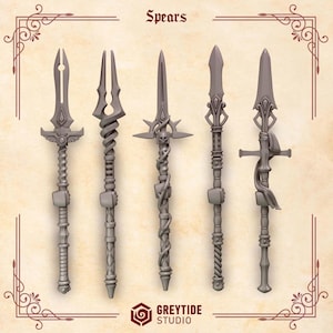May include: Five grey miniature spears arranged vertically, each featuring distinct ornate designs including winged guards, twisted shafts, skull motifs, and wrapped cloth details. The image includes the text "Spears" at the top and "GREYTIDE STUDIO" at the bottom.
