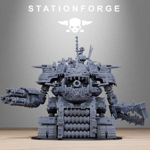 May include: A gray, detailed model of a war machine with multiple turrets, a large mouth-like opening, and a claw arm. The model is on a black base, with the text "STATIONFORGE" and a skull logo above it.