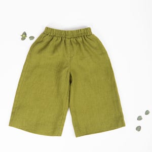 May include: Olive green linen pants with an elastic waistband.