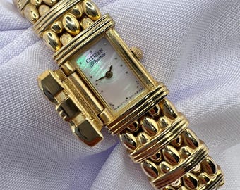 Reloj Citizen Elegance vintage para mujer, delicado, con diseño de peek-a-boo, en tono dorado, esfera de nácar, estilo elegante y preppy, estilo Oldmoney para esconderse y buscar