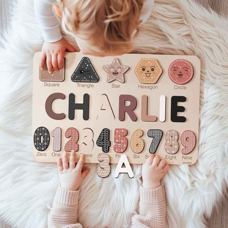 May include: Wooden educational puzzle board with the name "CHARLIE" and numbers 0-9. The board includes shapes like a square, triangle, star, hexagon, and circle. The puzzle pieces are in various colors and patterns.