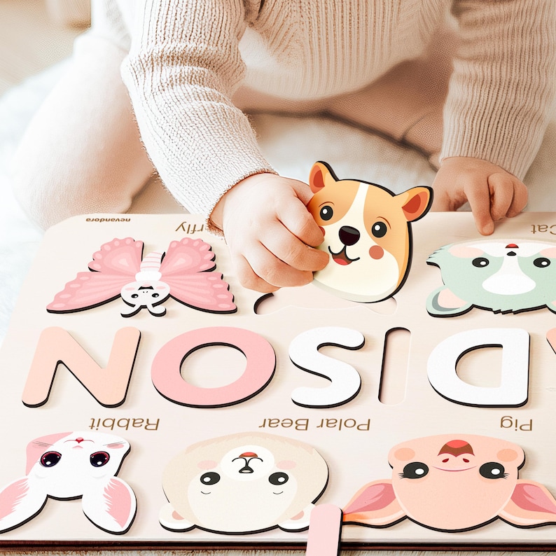 May include: A wooden puzzle with colorful animal and letter pieces. The puzzle features the letters D, I, S, O, and N. The animal pieces include a butterfly, a pig, a polar bear, a rabbit, and a dog. The puzzle is designed for children to learn the alphabet and animal names.