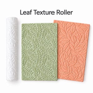 May include: A white cylindrical leaf texture roller alongside a sage green rectangular sheet and a coral orange rectangular sheet, both featuring an embossed leaf pattern. The text Leaf Texture Roller is printed above the items.