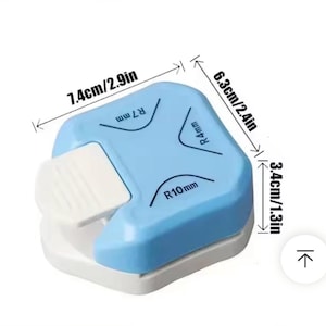 May include: A blue and white corner rounder tool. The tool measures 2.9 inches long, 2.4 inches wide, and 1.3 inches high. It has three corner radius options: R7 mm, R4 mm, and R10 mm. The tool has a white lever for easy operation.