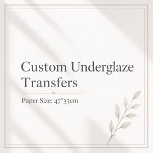 May include: A cream-colored background with the text "Custom Underglaze Transfers" in dark grey. Below the text is "Paper Size: 47*33cm". A decorative sprig of leaves is in the lower right corner.