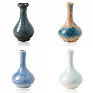 May include: Four ceramic vases with narrow necks and bulbous bodies. One is dark teal with a glossy finish, one is tan with blue crystalline patterns, one is light blue with textured blue accents, and one is a pale, glossy off-white color.