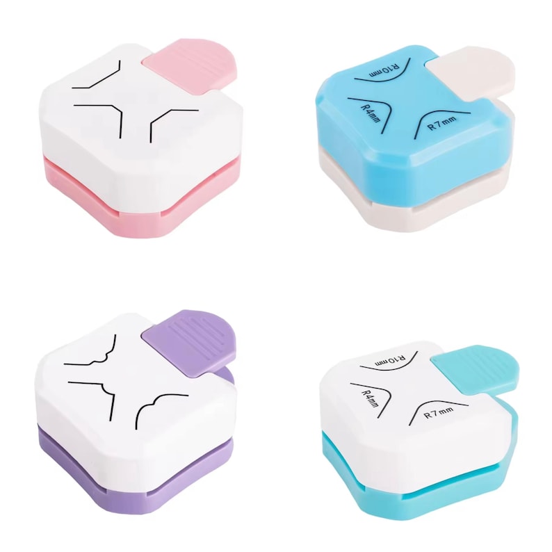 May include: Four corner rounder punches in pink, blue, purple, and teal. Each punch has a white top with black corner guides and a colored base. The blue and teal punches have R4mm, R7mm, and R10mm markings. Each punch has a colored lever.
