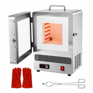 May include: A stainless steel kiln with an open door revealing a white interior with glowing orange heating elements. The unit features a digital temperature display, a red power switch, a top handle, and a pair of red heat-resistant gloves and metal tongs.