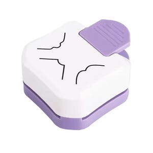 May include: A white and lavender corner paper punch with a lavender lever. The punch has a square shape with rounded corners and black line art. This craft tool is used for paper crafting and scrapbooking.