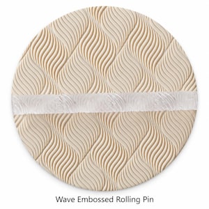 May include: A cylindrical rolling pin featuring a light beige surface with a repeating embossed wave pattern. A horizontal band of translucent material runs across the center of the cylinder. The text Wave Embossed Rolling Pin is below.