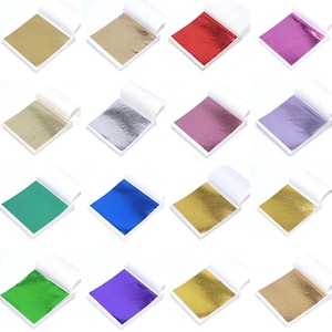 May include: A set of three ceramic mugs with a speckled, matte finish in cream, light grey, and dark grey. Each mug has a simple, minimalist design, ideal for tea or coffee.