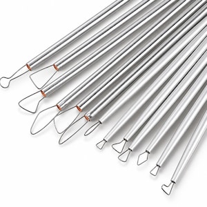 May include: A set of eleven silver-colored metal clay sculpting tools, each featuring a long, cylindrical handle and a unique wire loop tip in various geometric shapes, including triangles, circles, and teardrops, arranged in a fan-like pattern.