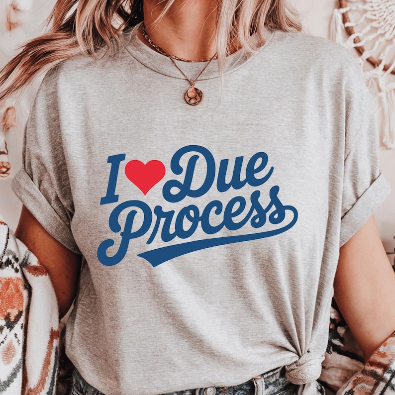 a woman wearing a t - shirt that says i love due process