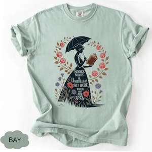 a t - shirt with an image of a woman holding an umbrella
