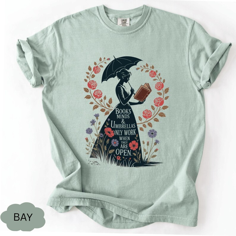 a t - shirt with an image of a woman holding an umbrella