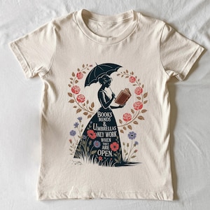 a t - shirt with an image of a woman holding an umbrella