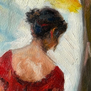 May include: Oil painting of a person from the back, wearing a red dress. The person's dark hair is pulled up, with a glimpse of red. The background features white, yellow, and blue brushstrokes, suggesting a window or outdoor scene.