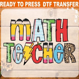May include: A colorful DTF transfer design with the words "MATH TEACHER" in a playful font. The letters are designed with pencils, rulers, apples, and leopard print. The text "READY TO PRESS DTF TRANSFER" is at the top.