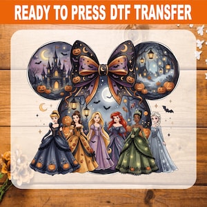 May include: A ready to press DTF transfer featuring a large black bow centered above six animated princesses in ballgowns. The design includes a dark castle, hanging lanterns, pumpkins, bats, and a crescent moon against a night sky background.