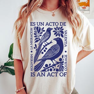 Migration Is An Act Of Courage Shirt, La Migracion Es Un Acto De Valentia T-Shirt, Pro Immigration Sweatshirt, Political Statement Tee