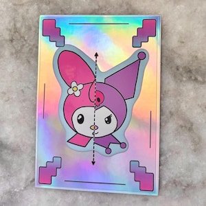 May include: A holographic sticker with a cartoon character in pink and purple. The character has a flower on its ear and is set against a light blue background. The sticker is rectangular with pink pixelated corners. The overall design is vibrant.