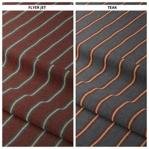 May include: Two fabric swatches with a striped pattern. The swatch on the left is a dark red color with thin beige stripes. The swatch on the right is a dark gray color with thin beige stripes. The text "FLYER JET" is above the left swatch and the text "TEAK" is above the right swatch.