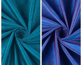 May include: Two swatches of fabric, one teal blue and one blue with a purple sheen. The fabric is smooth and silky. The text "POOLSIDE PARTY" is above the teal blue swatch and the text "AFINA" is above the blue swatch.