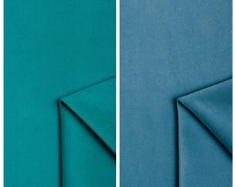 Velours uni vendu au mètre pour rideaux, ameublement, canapés, chaises, banquettes et décoration intérieure. Vert/Bleu turquoise