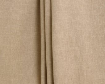 May include: Close-up of a wheat-colored fabric with a subtle texture. The fabric is folded in a few places, creating a soft, draping effect.
