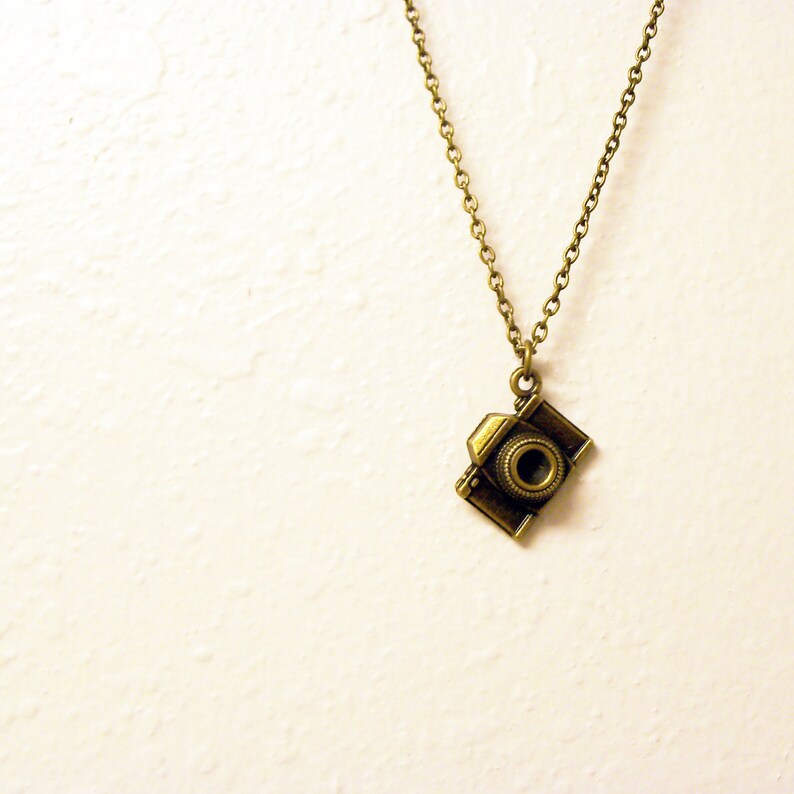 Vintage bronze camera charm necklace on a delicate antique Etsy