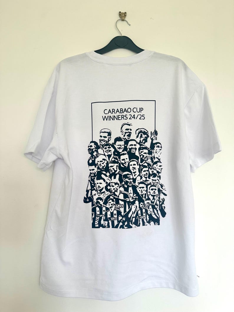 May include: White t-shirt with a black and white graphic print of a group of people. The graphic includes the text "Carabao Cup Winners 24/25".