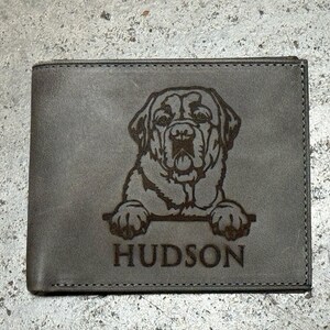 May include: A brown leather wallet with a laser engraved image of a dog's head and the name "HUDSON".
