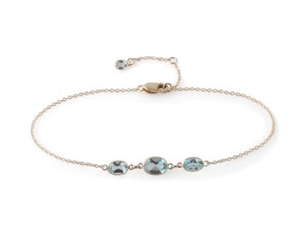 Three stone bezel set blue topaz bracelet