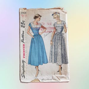 May include: Vintage Simplicity sewing pattern for a dress, featuring two models wearing different styles. The pattern number is 2908, size 14, and costs 25 cents. The text "Printed Pattern" is printed vertically on the left side of the image.