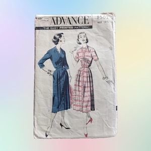 May include: Vintage sewing pattern for two dresses, one blue and one pink and white, with the text "Advance...The Easy Printed Pattern!" and "8502 Size 14 1/2".
